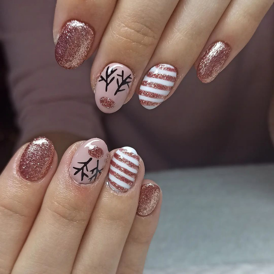 Nails with stripes and reindeer design.