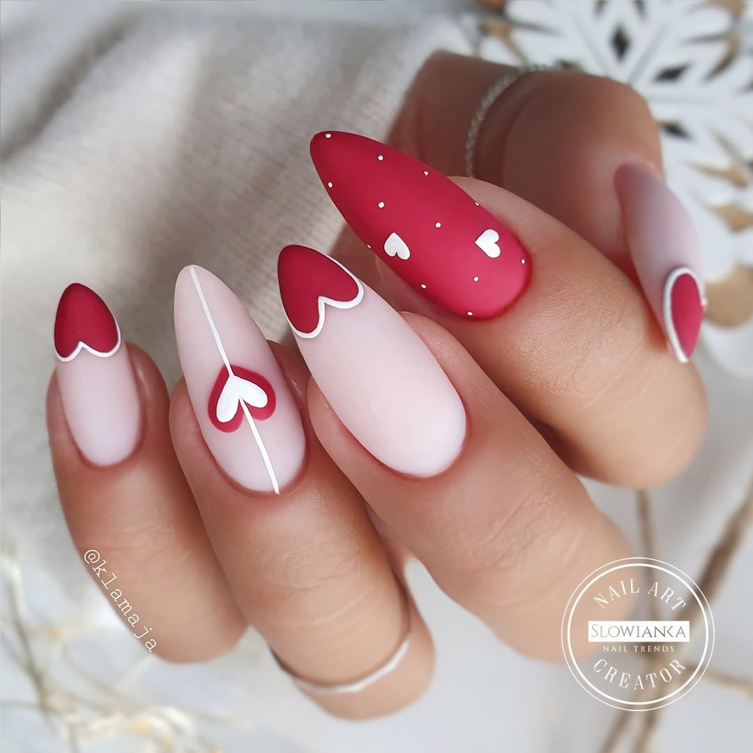 nail art with red and pink heart design.