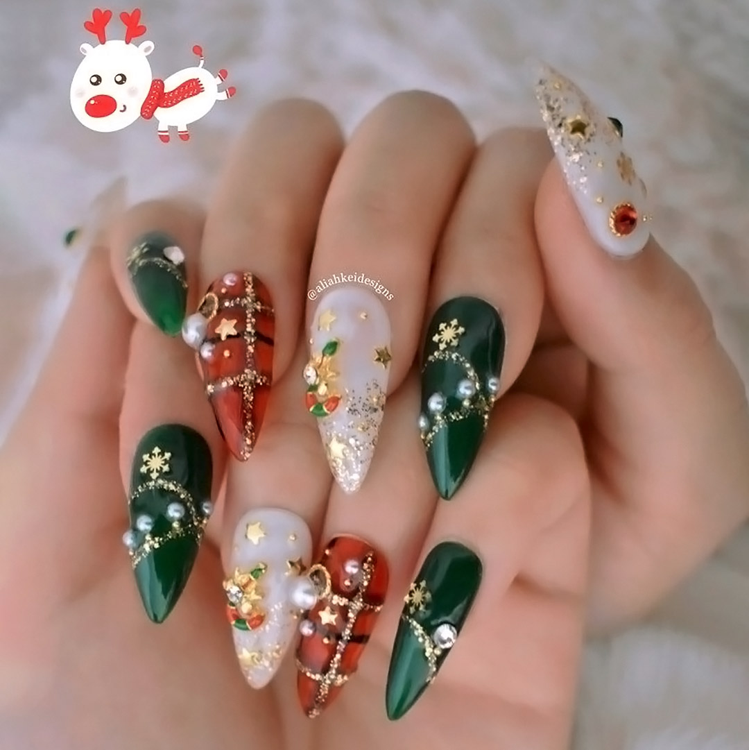 Red and green nails with festive ornaments.