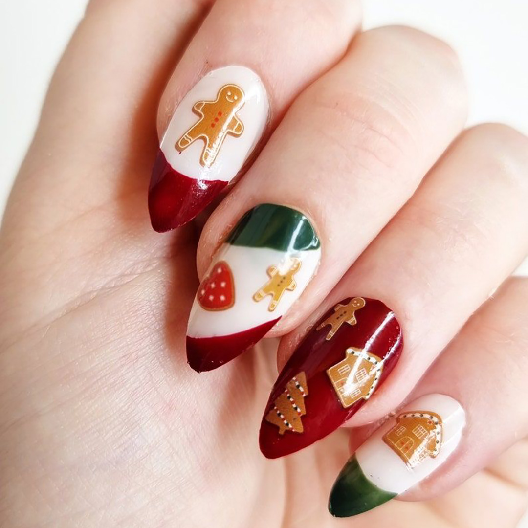 Red and green nails with gingerbread man and houses.