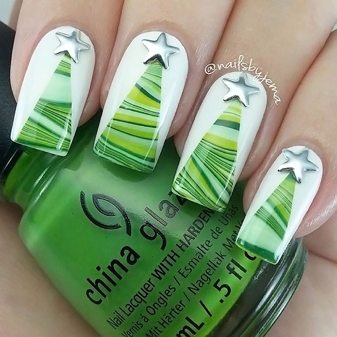 White nails with simple Christmas trees.