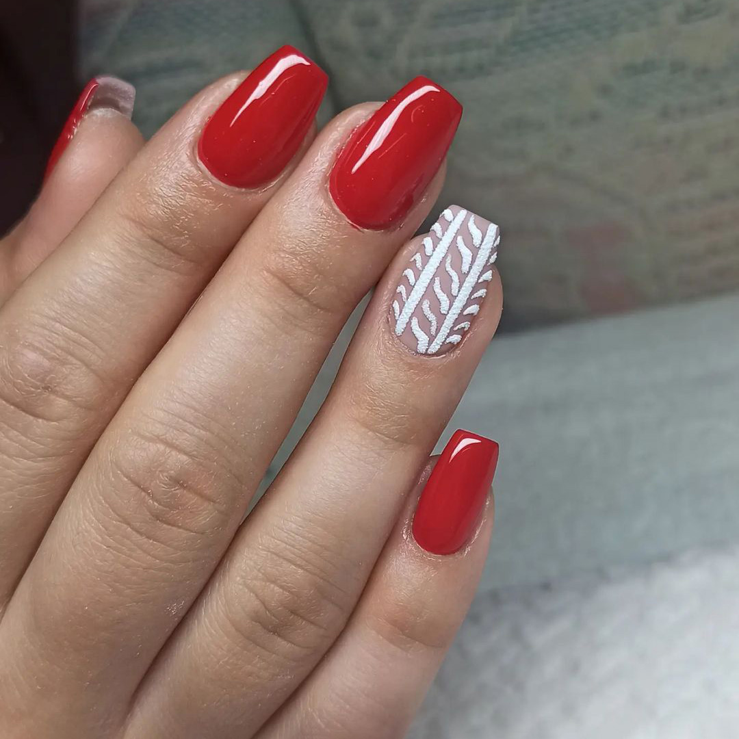 Nails with red snowy design.