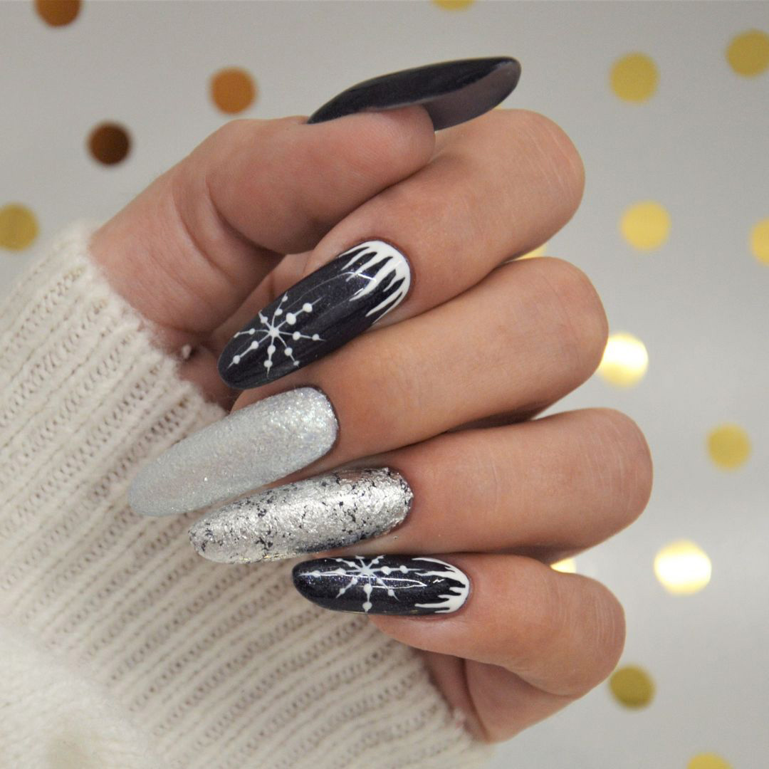 Nails with silver and dark snow design.