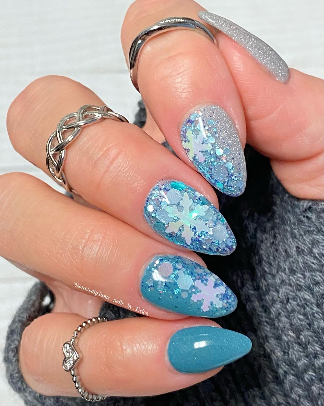 Nails with snowglobe and glitter design.