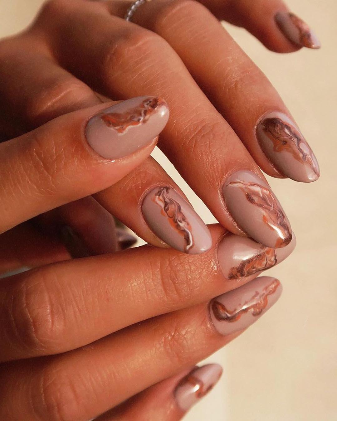 Nail set styled with a marbled look.