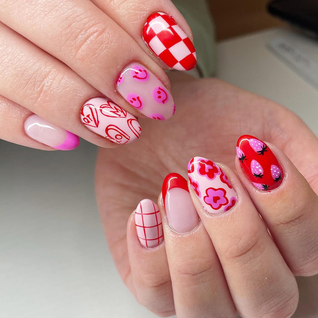 nail art with strawberries and happy face design.