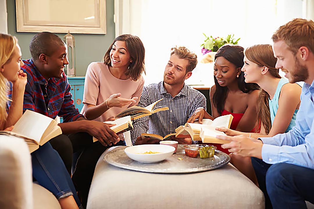 Group of people having a book club gathering.