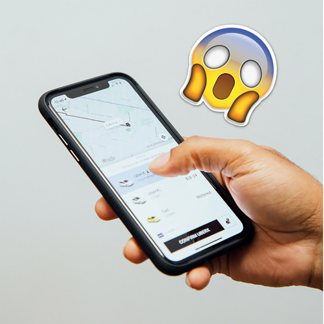 The Uber app showing dynamic prices and a surprised emoji.