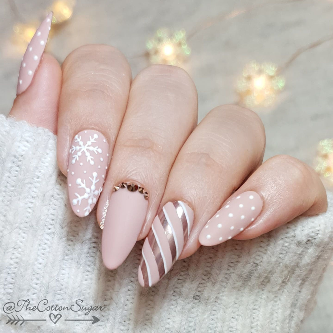 Nails with snowflakes and swirls.